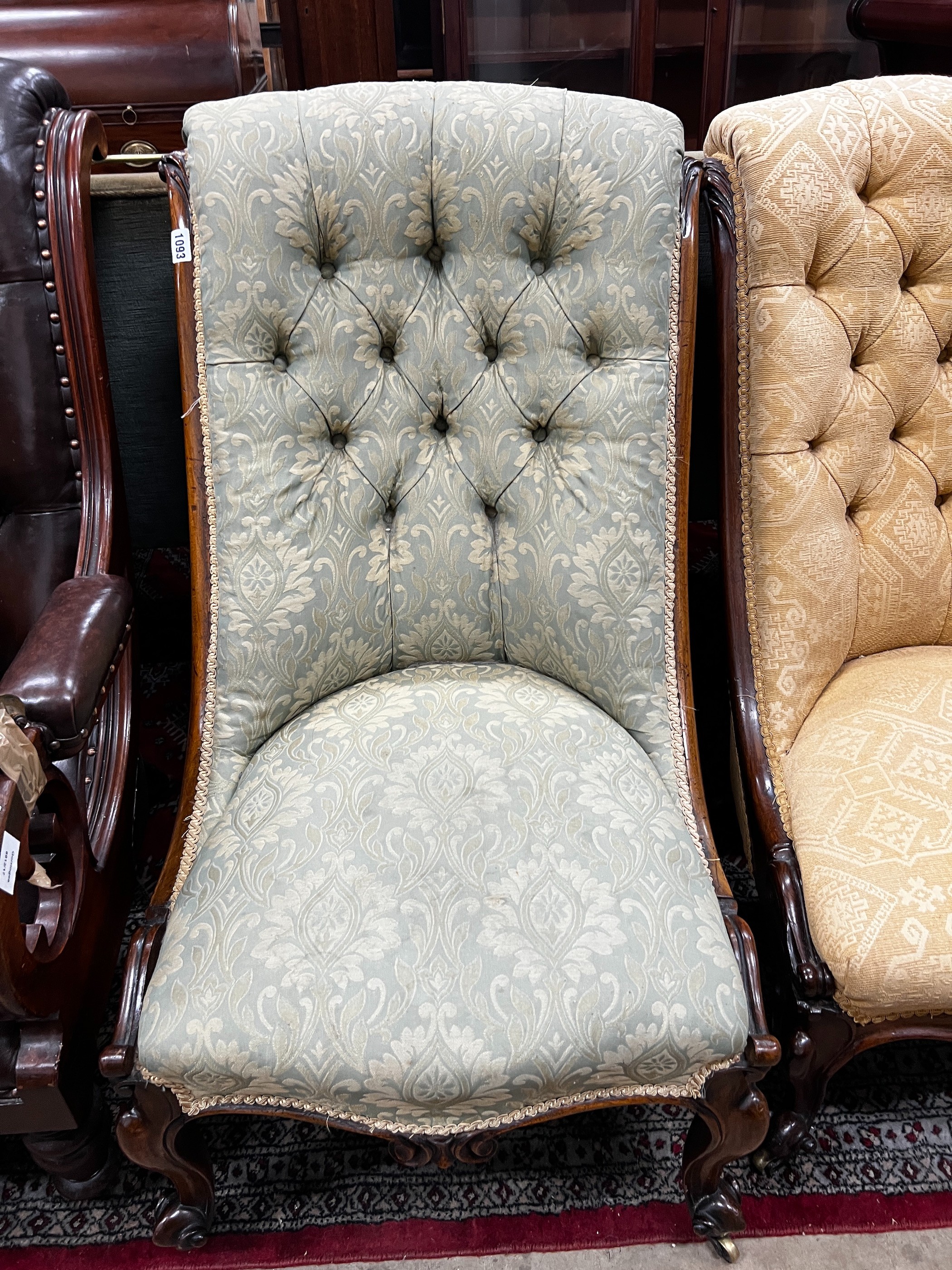 A near pair of Victorian mahogany and rosewood upholstered nursing chairs width 54cm, height 91cm *Please note the sale commences at 9am.